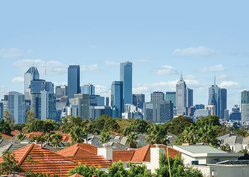 Australian property with city skyline over suburban houses